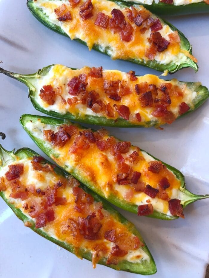 4 halved jalapenos stuffed with cheese and bacon