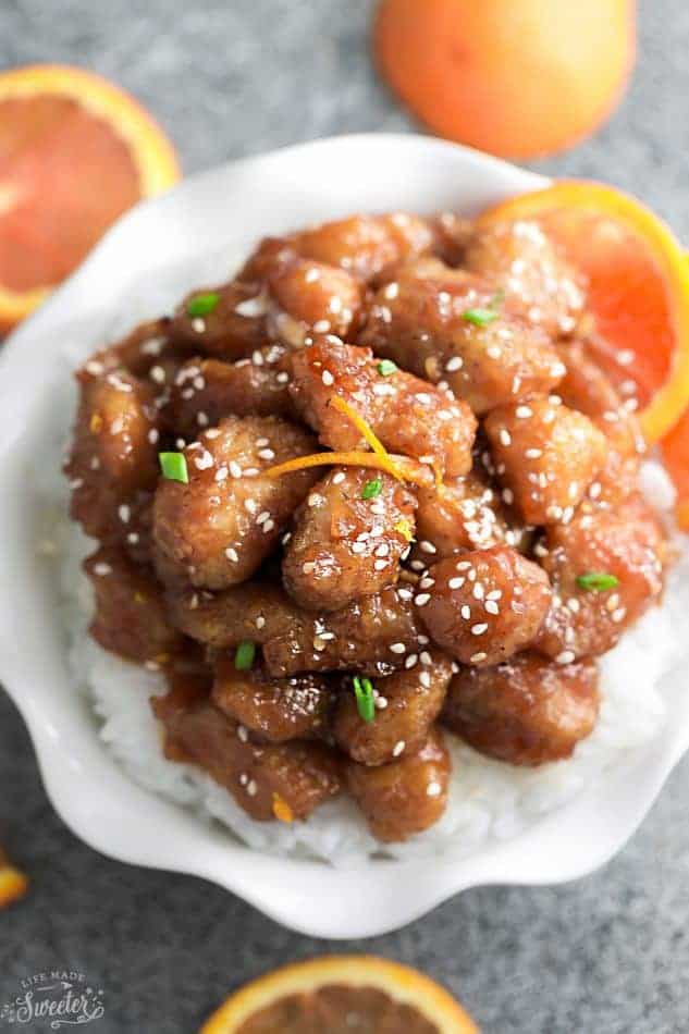 Keto orange chicken on a white scalloped plate