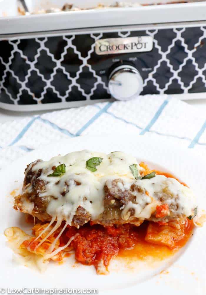 Low carb meatball casserole in front of a patterned slow cooker