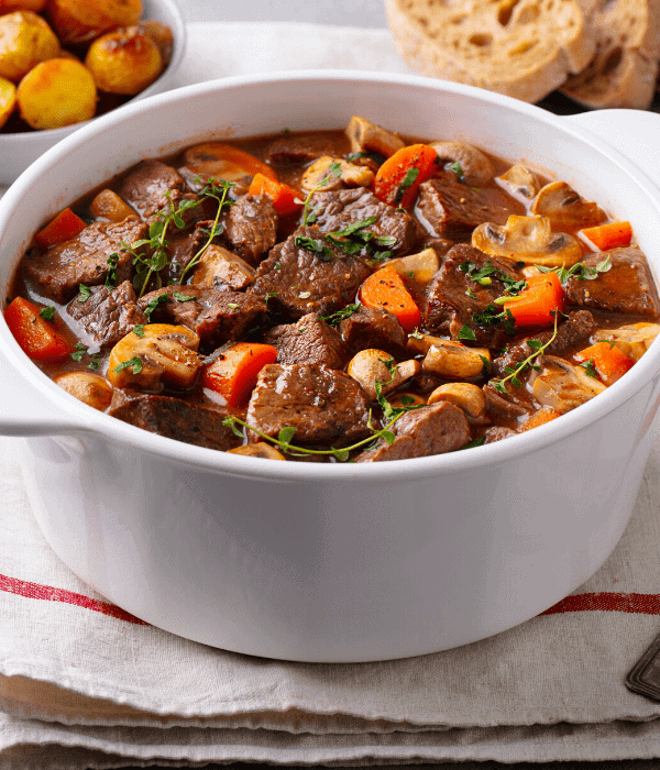 A white bowl of slow cooker beef stew