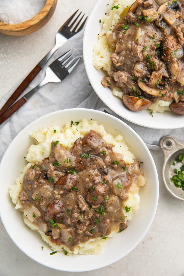 Overhead photo of plated whole30 beef stroganoff on top of mashed potatoes