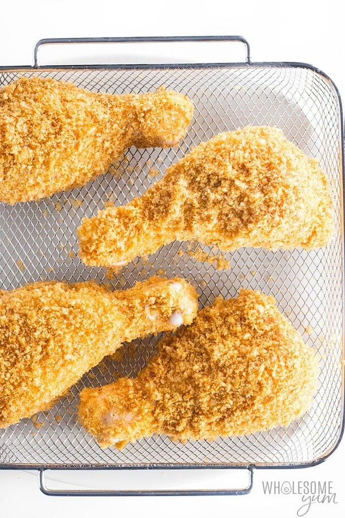 Fried chicken legs on an air fryer rack