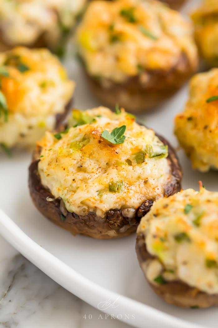 Crab stuffed mushrooms on a white plate