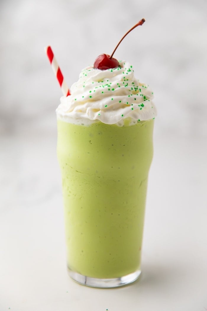 Healthy mint shake with whipped cream and a maraschino cherry