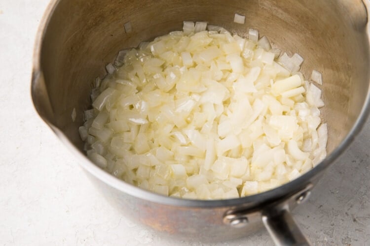 Onions and butter in a large silver saucepan