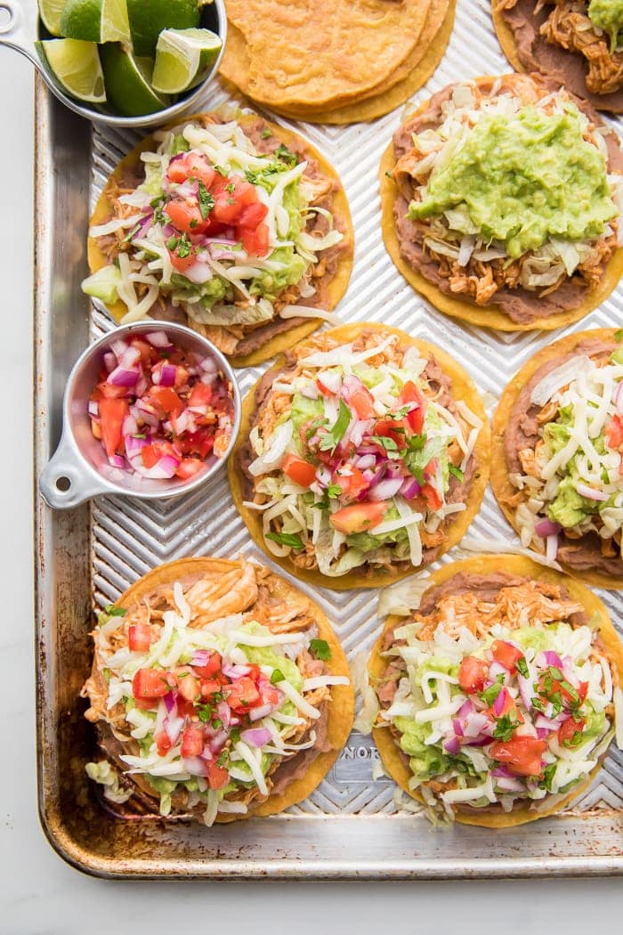 Healthy tostados on a large baking sheet pan