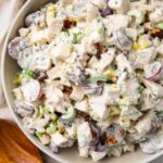 Chicken salad with grapes in a large silver bowl