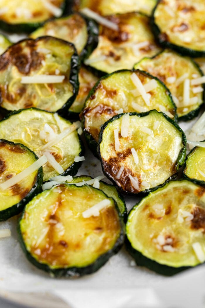Close-up image of air fried zucchini slices.
