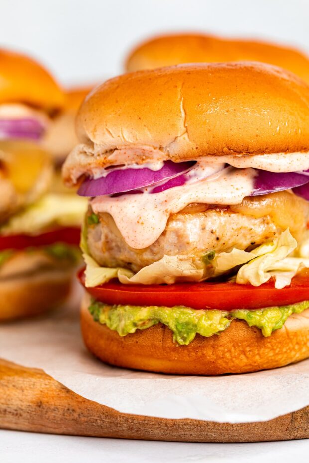 Close-up image of chicken burgers with chipotle aioli.