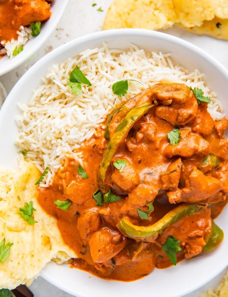 Instant Pot Chicken Tikka Masala in a bowl with basmati rice and naan