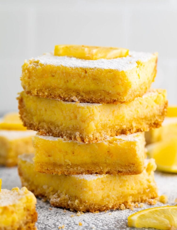 A stack of 4 keto lemon bars against a white background