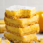 A stack of 4 keto lemon bars against a white background