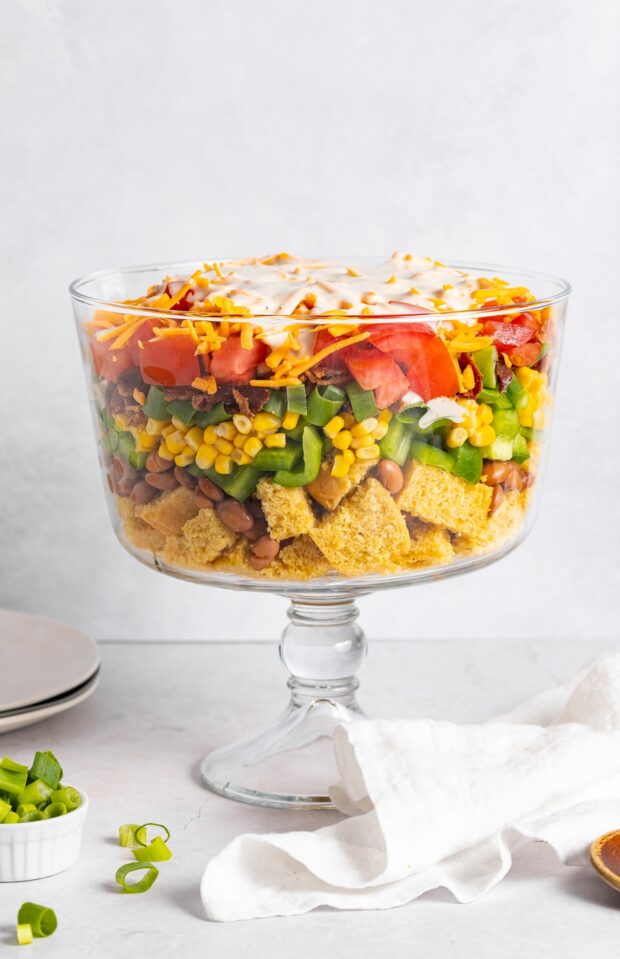 cornbread salad layered in a trifle dish