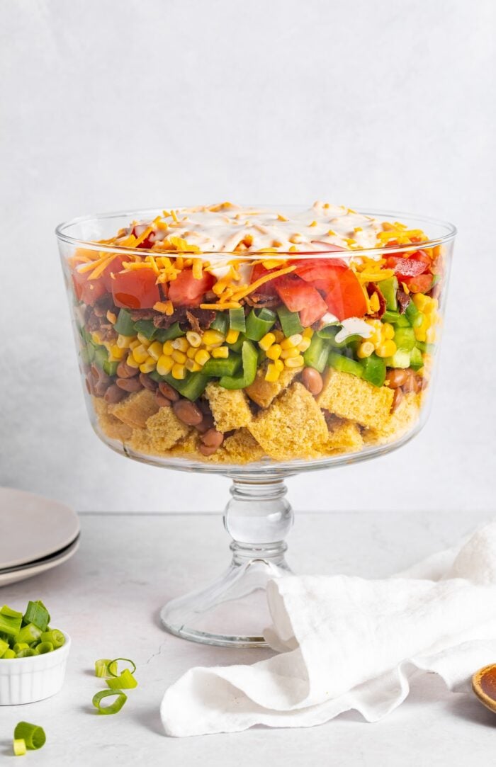 cornbread salad layered in a trifle dish