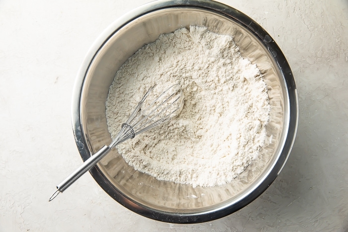 Flour mixtur in large meta mixing bowl