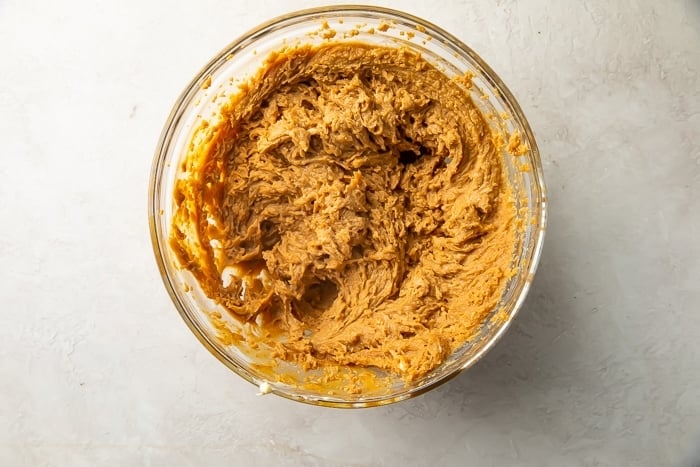 Gluten free peanut butter cookie dough in large glass mixing bowl