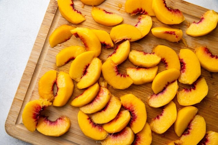Peach slices on a cutting board