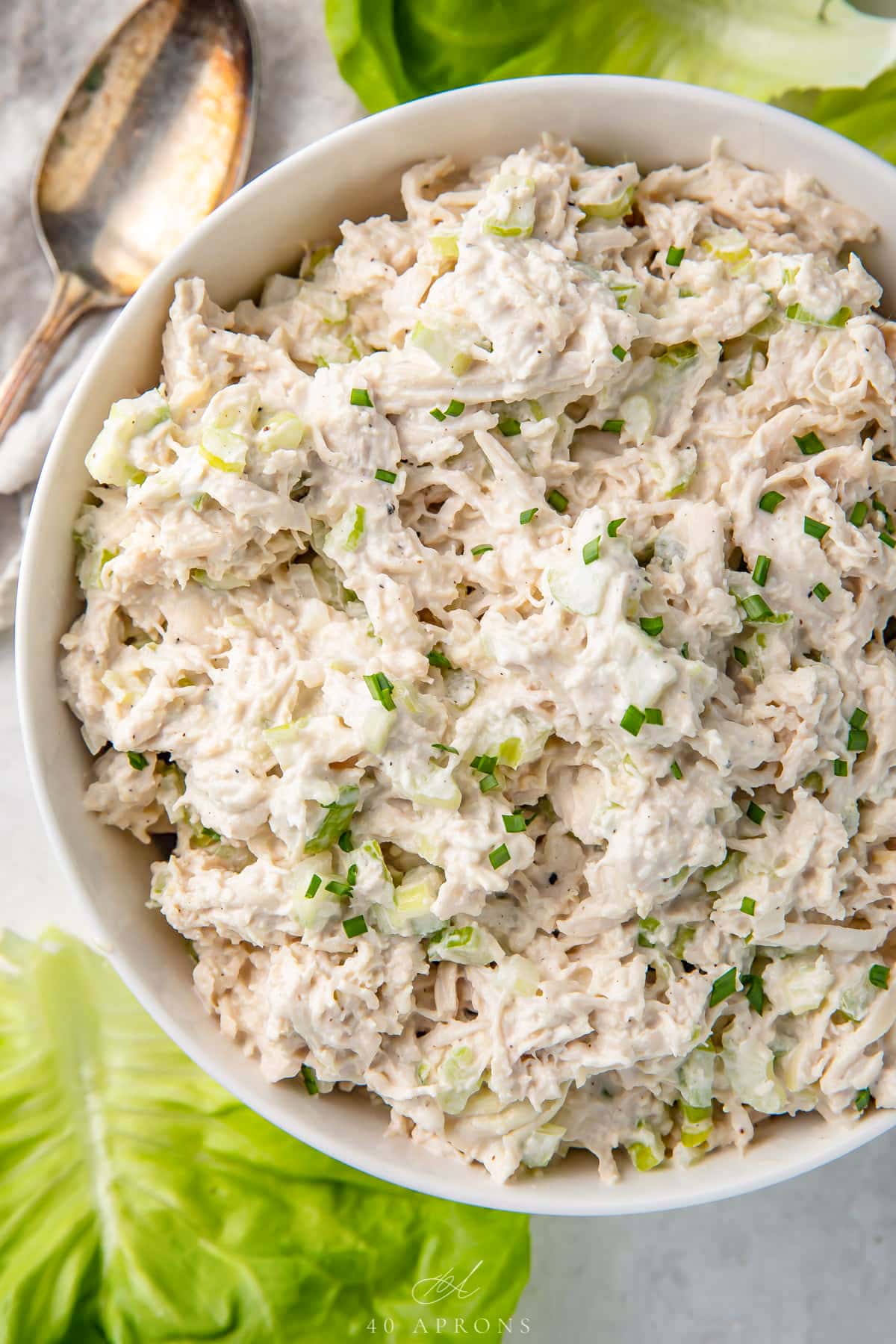 A white bowl holding classic shredded keto chicken salad.