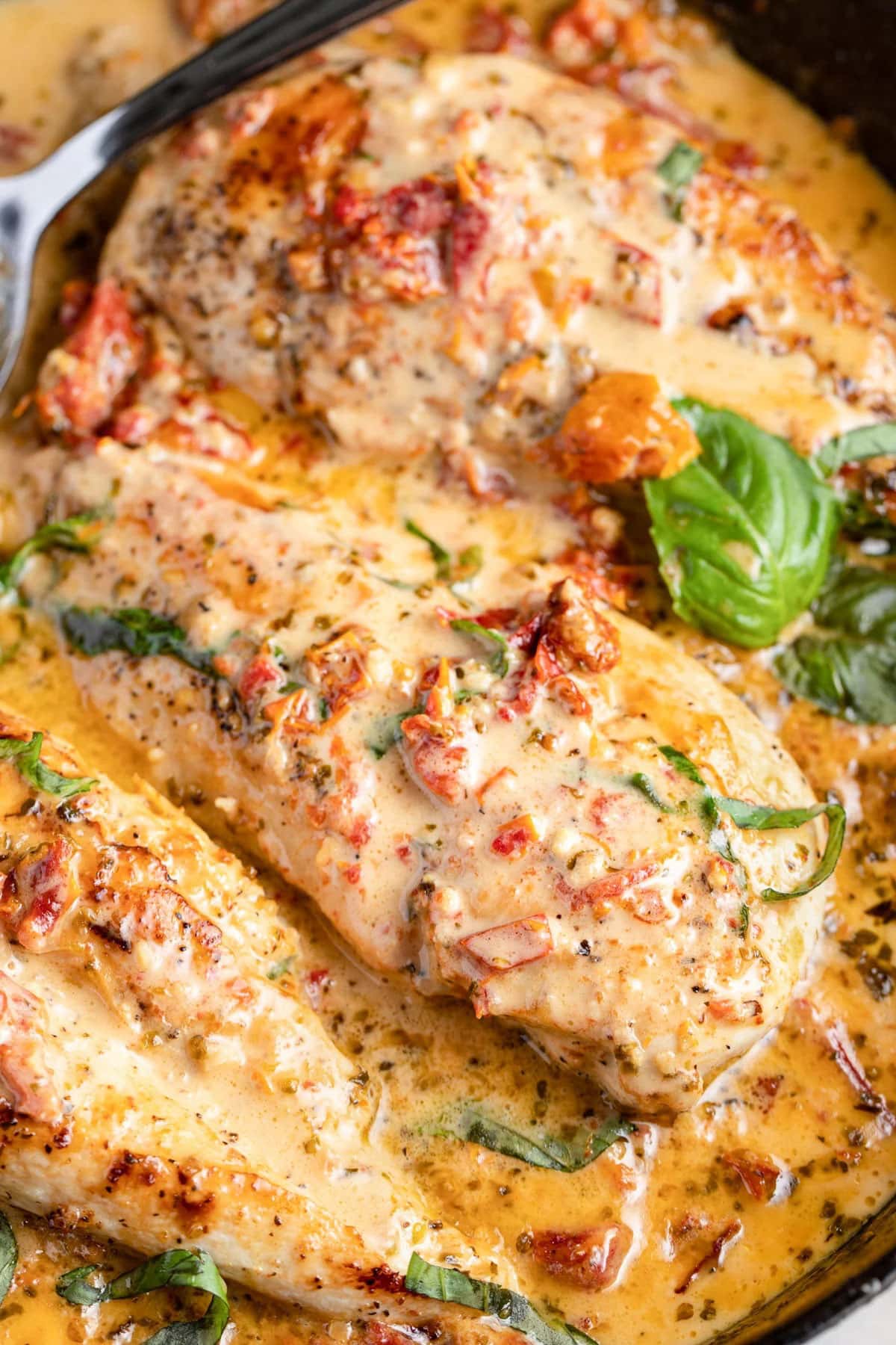 Reader favorite marry me chicken in a creamy sauce topped with basil and sun-dried tomatoes.