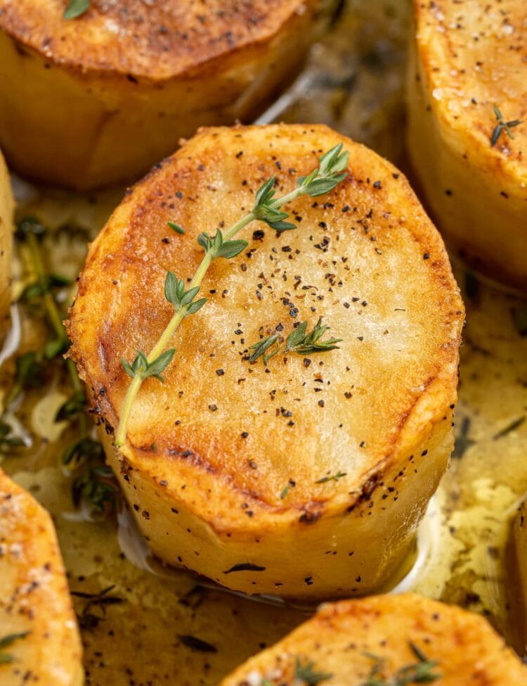 close-up image of fondant potatoes in a skiller