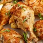 close up image of instant pot chicken legs with fresh parsley on top