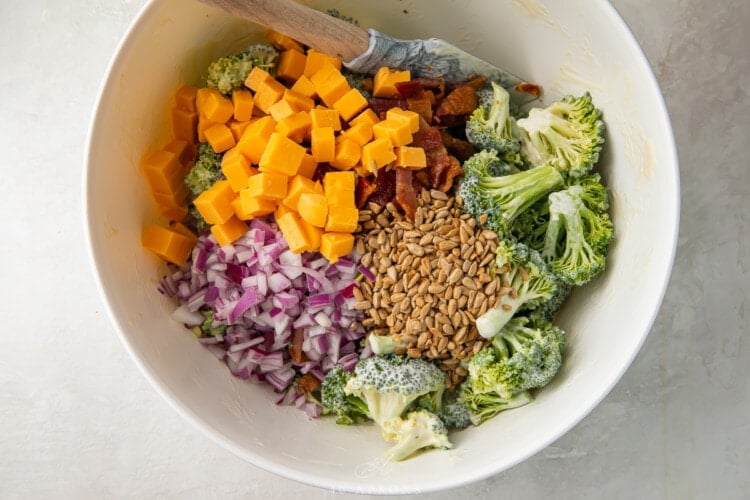 Ingredients for keto broccoli salad in a large bowl