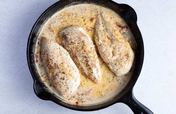 Chicken breasts in marry me sauce in cast iron skillet