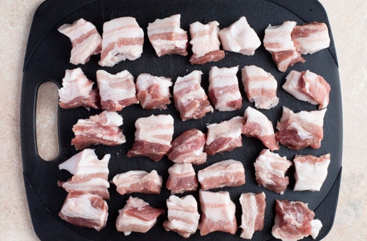 Raw pork belly cut into cubes