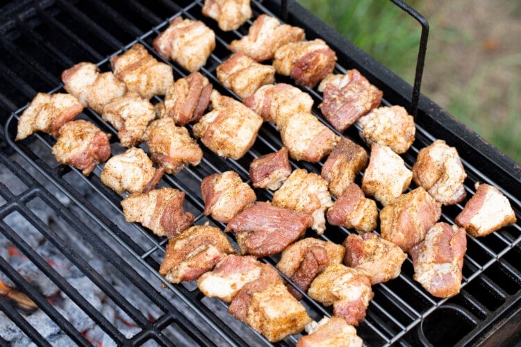 Pork belly cubes on charcoal grill