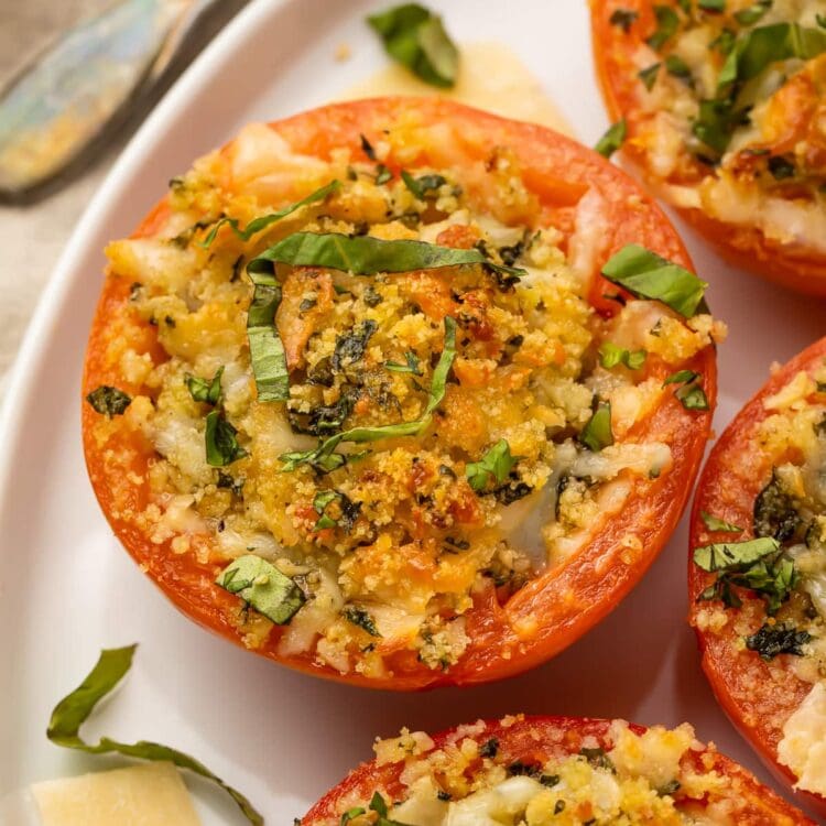 Close up photo of a stuffed tomato on a plate