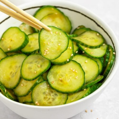 japanese cucumber salad in a bowl with chopsticks