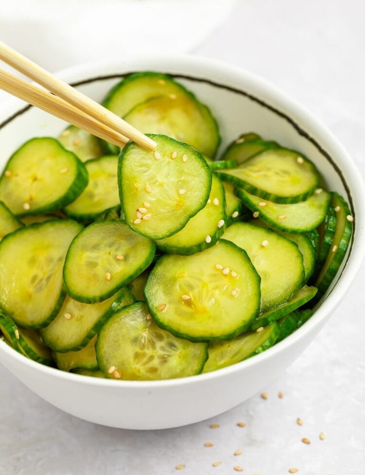 japanese cucumber salad in a bowl with chopsticks