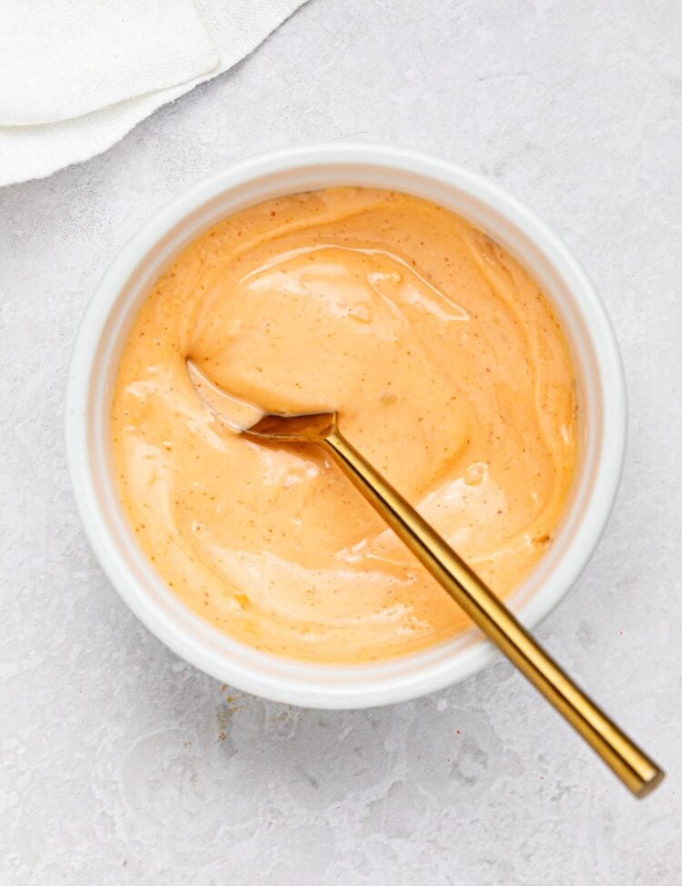 spicy mayo in a bowl with a spoon