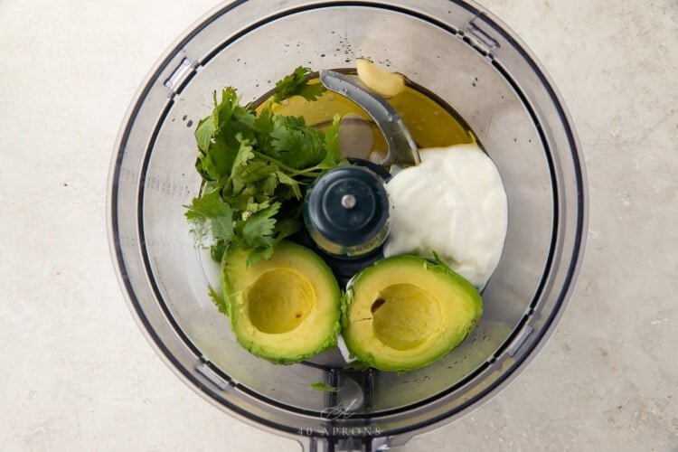 ingredients for avocado dressing in a food processor bowl