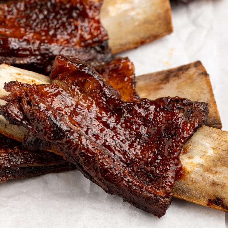 BBQ beef back ribs on a sheet of parchment paper.