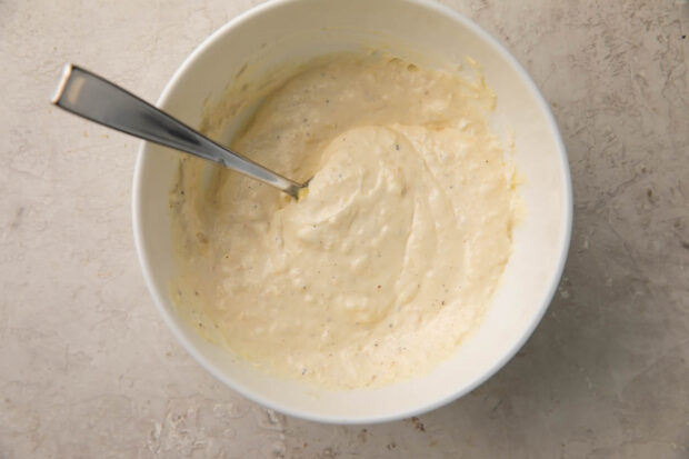 Creamy parmesan dipping sauce in bowl