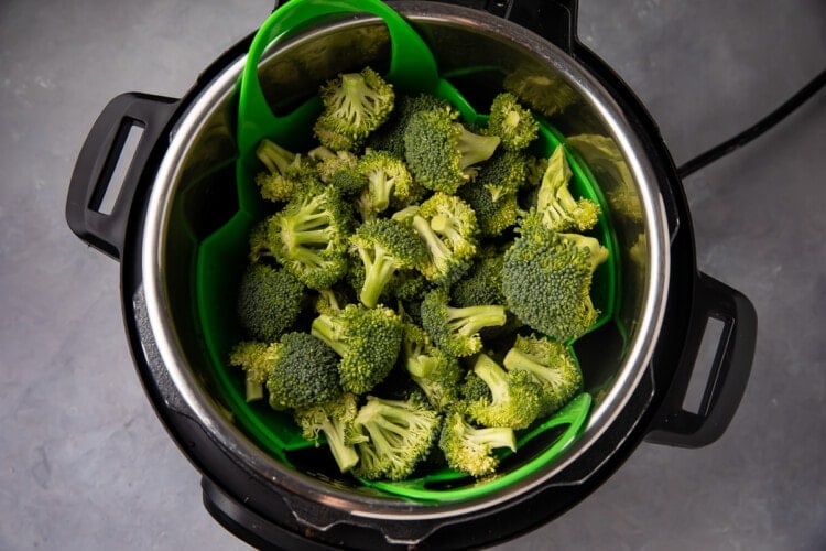 Instant Pot with steamer basket and broccoli florets
