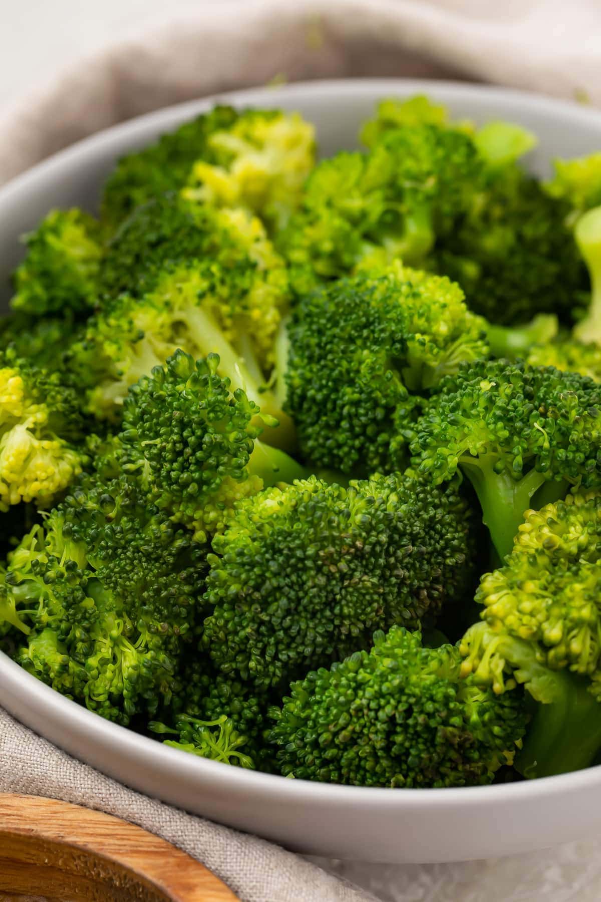 Instant Pot broccoli in a white bowl