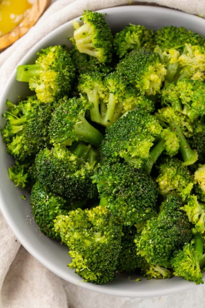 Instant Pot broccoli in a white bowl