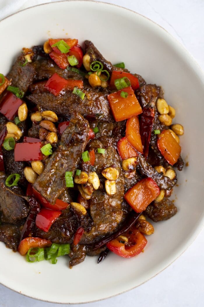Kung pao beef in a white bowl