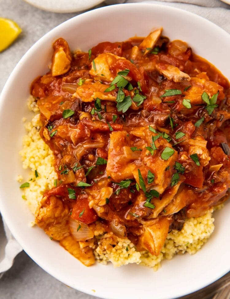 Overhead photo of Moroccan chicken stew in a white bowl
