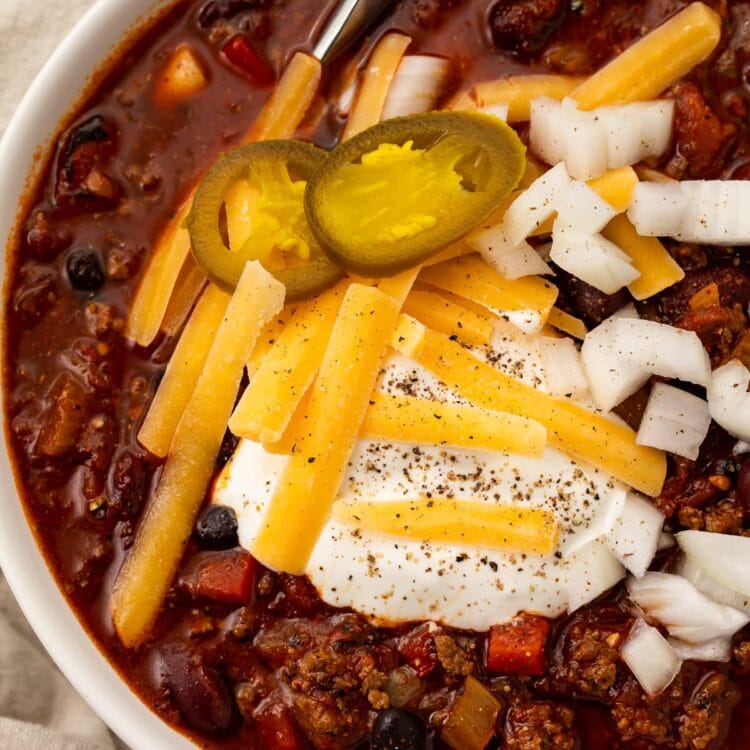 Overhead photo of nourishing slow cooker chili in a white bowl