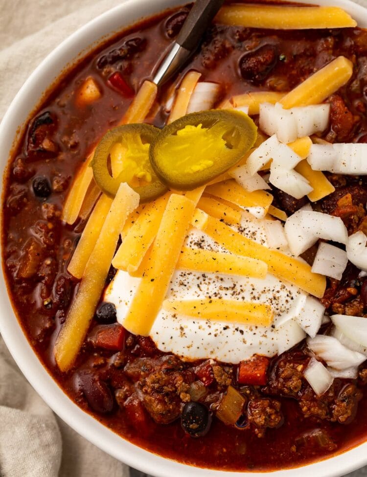 Overhead photo of nourishing slow cooker chili in a white bowl