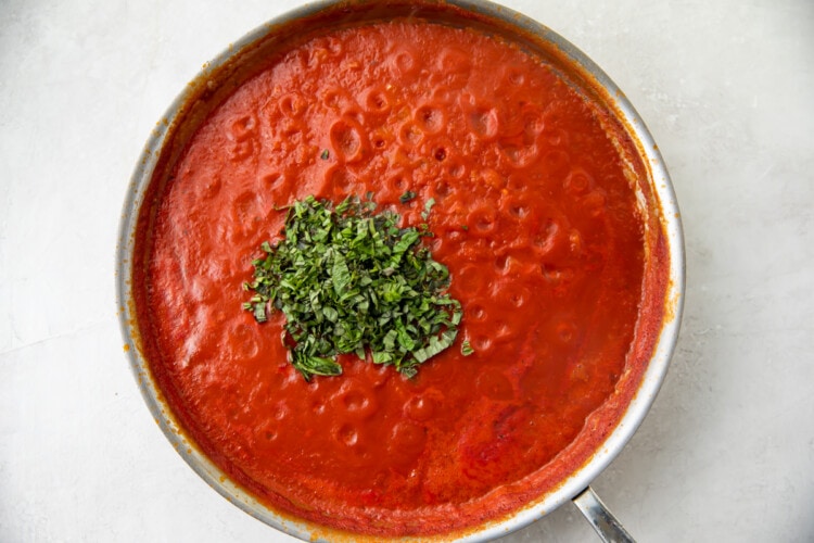 Tomatoes and basil in large saucepan