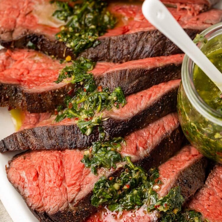 Sous vide tri tip close up with chimichurri sauce
