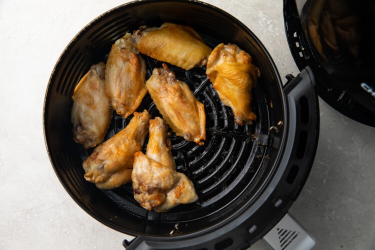 Air fryer chicken wings in air fryer basket