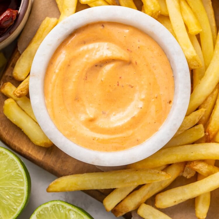 French fries surrounding a small bowl of chipotle mayo