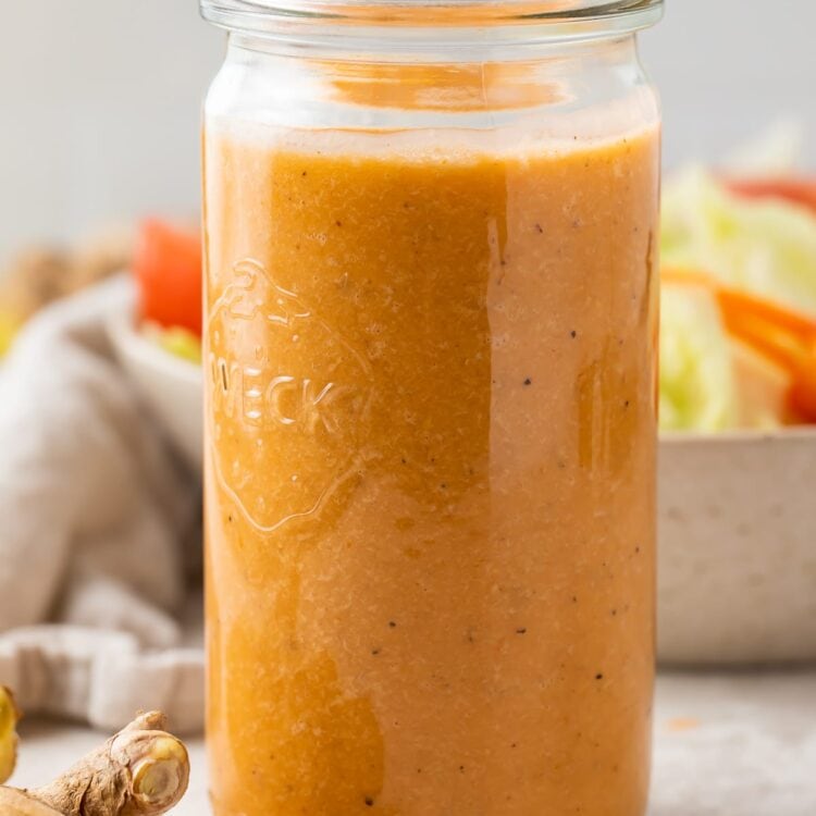 Ginger salad dressing in a tall glass jar