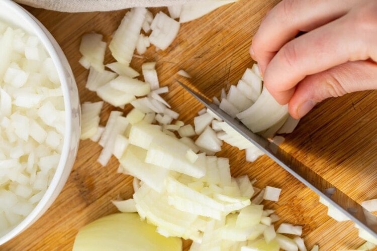 Rotate slices and cut every half inch to dice remaining onion.