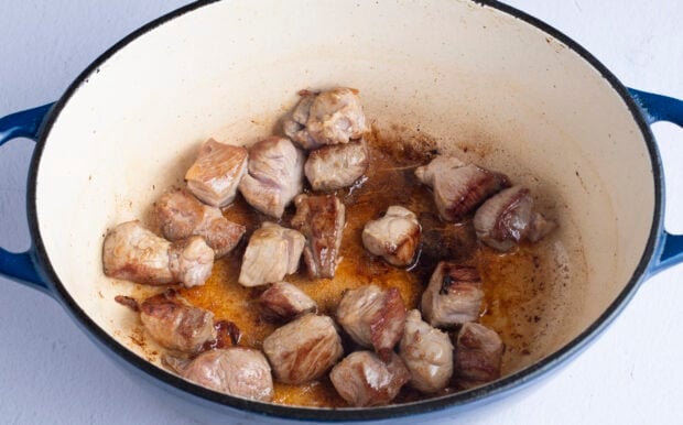 Pork chunks in neutral oil in dutch oven